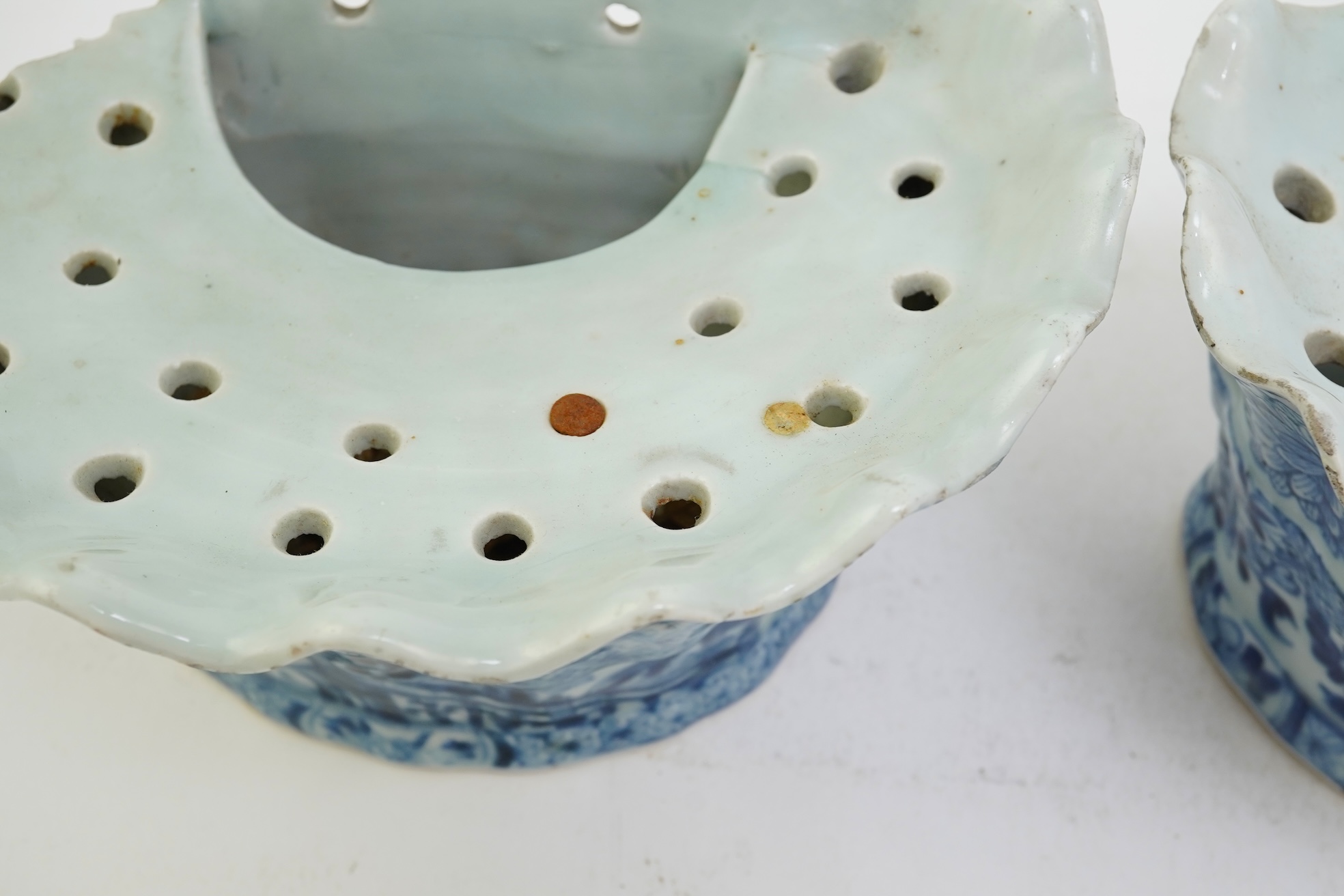 A pair of unusual Chinese export blue and white bough pots, after a Delft model, Qianlong period